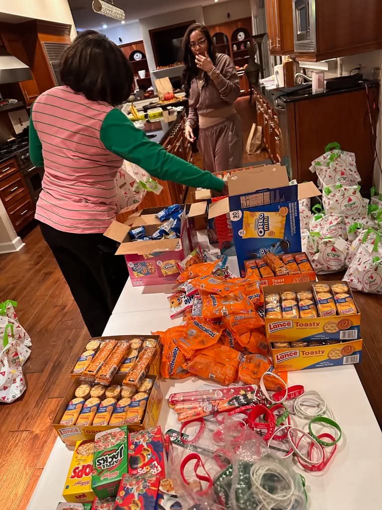 Sorting donated snacks and gifts on a table